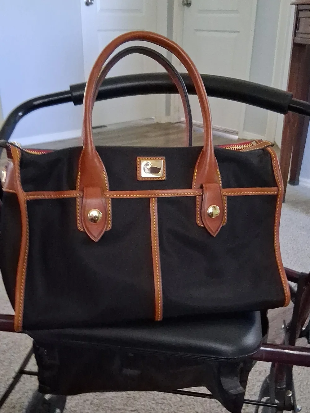 Dooney & Bourke Black Satchel with Brown Leather Trim and Gold Hardware